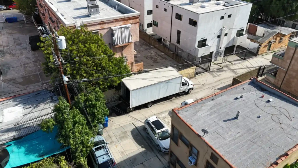 Moving truck parked in a tight alley in the Hollywood area