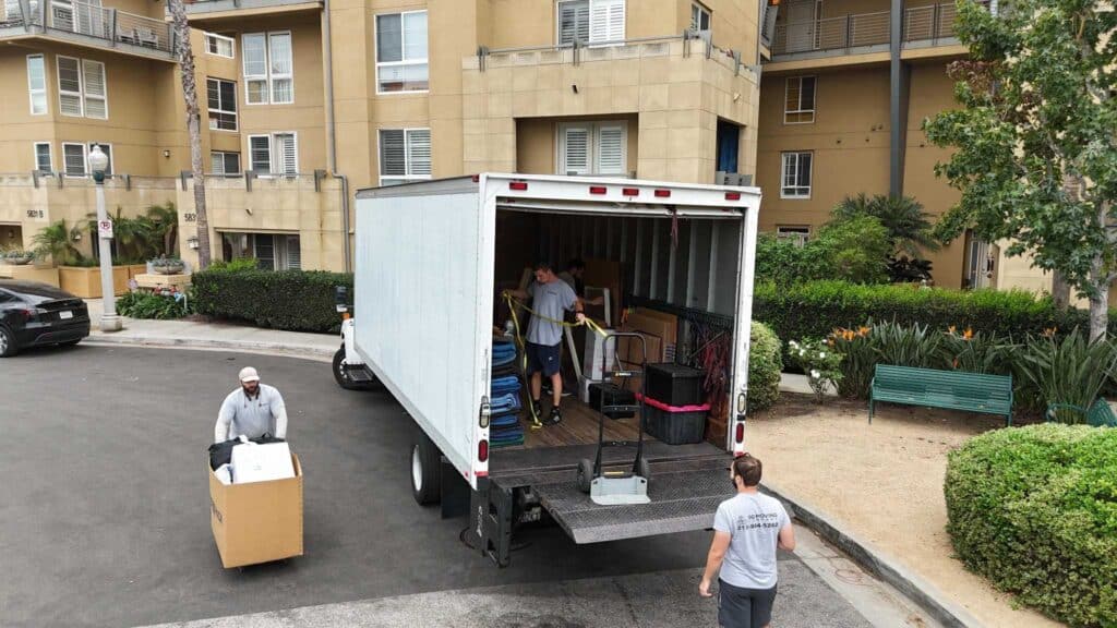 Moving to Santa Monica: Your Complete 2025 Guide to Living, Working & Thriving by the Coast 6 Professional movers in Santa Monica packing furniture for a coastal apartment move