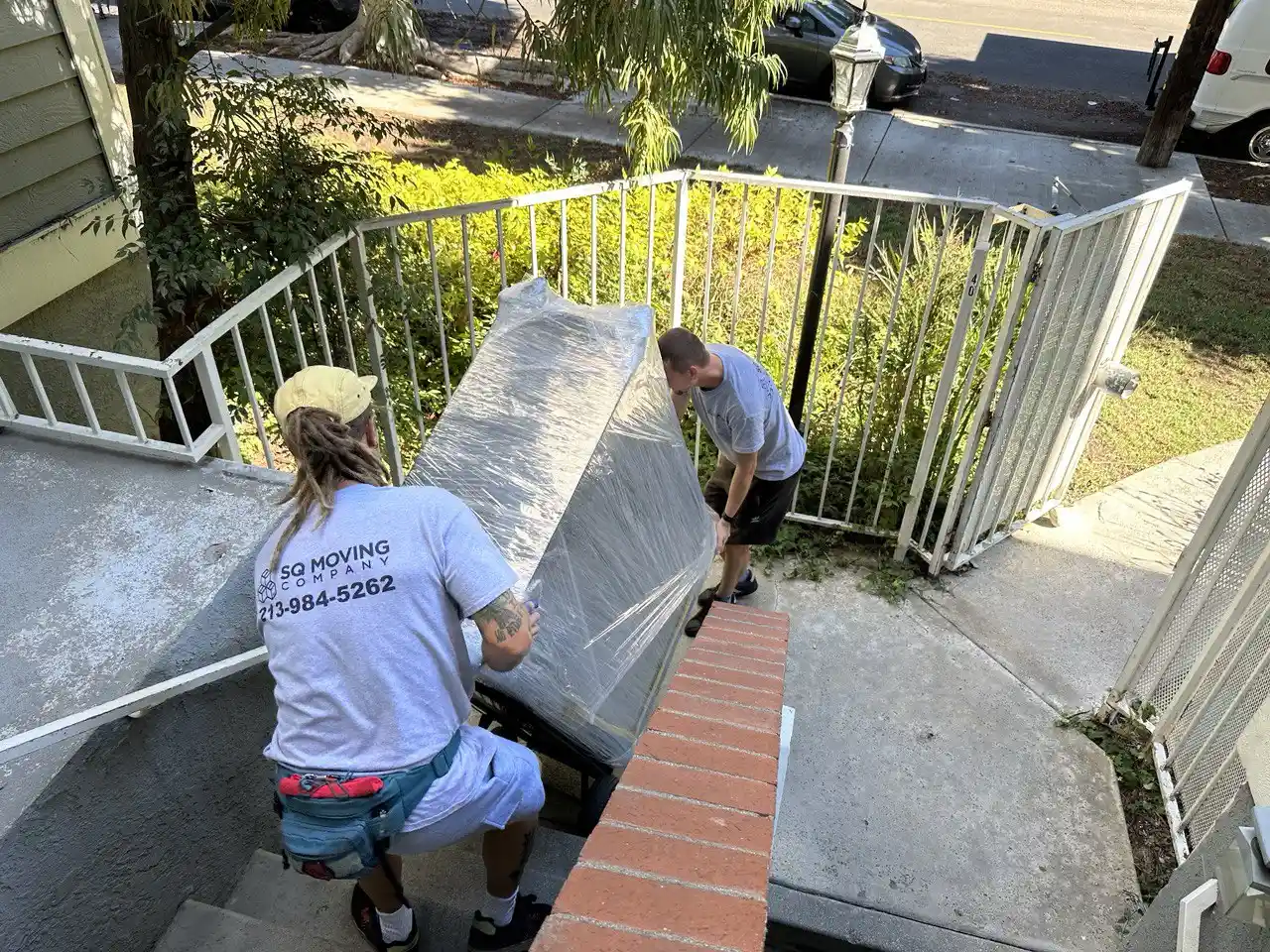 Professional Sierra Madre moving company loading household furniture into a moving truck