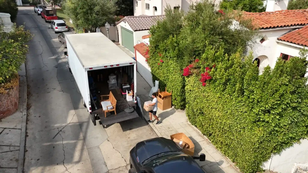 Reserved street parking for a moving truck in a hillside neighborhood