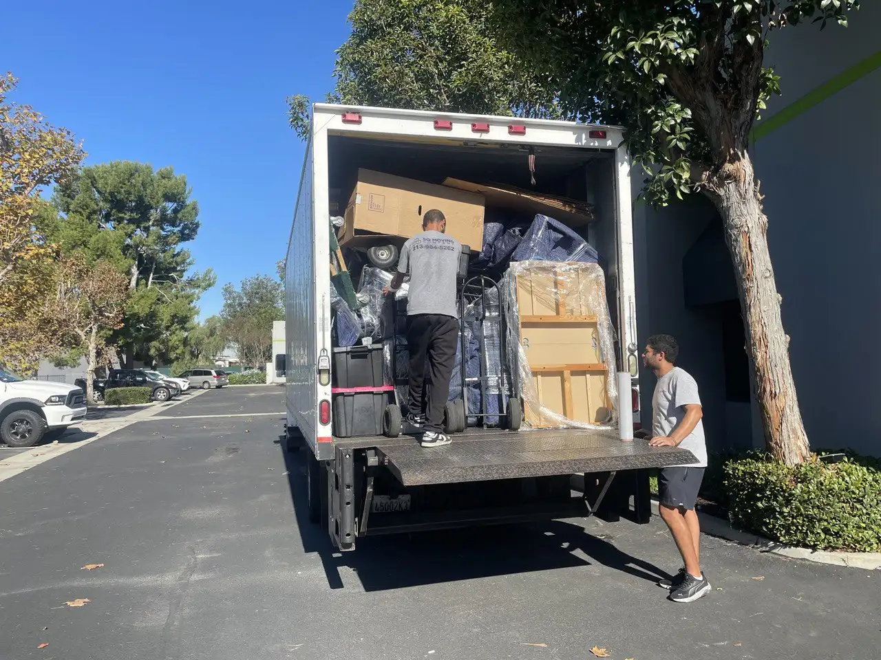 SQ Moving Company team loading a fully packed moving truck during a Redondo Beach relocation.