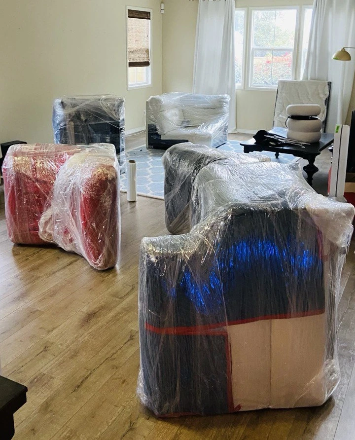 labor movers packing the furniture in the apartment