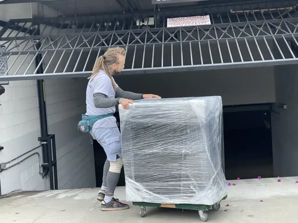 How to Prepare Furniture for Moving in LA: Step-by-Step Guide 9 Moving of sectional couch park on four-wheeler. How to use moving equipment.