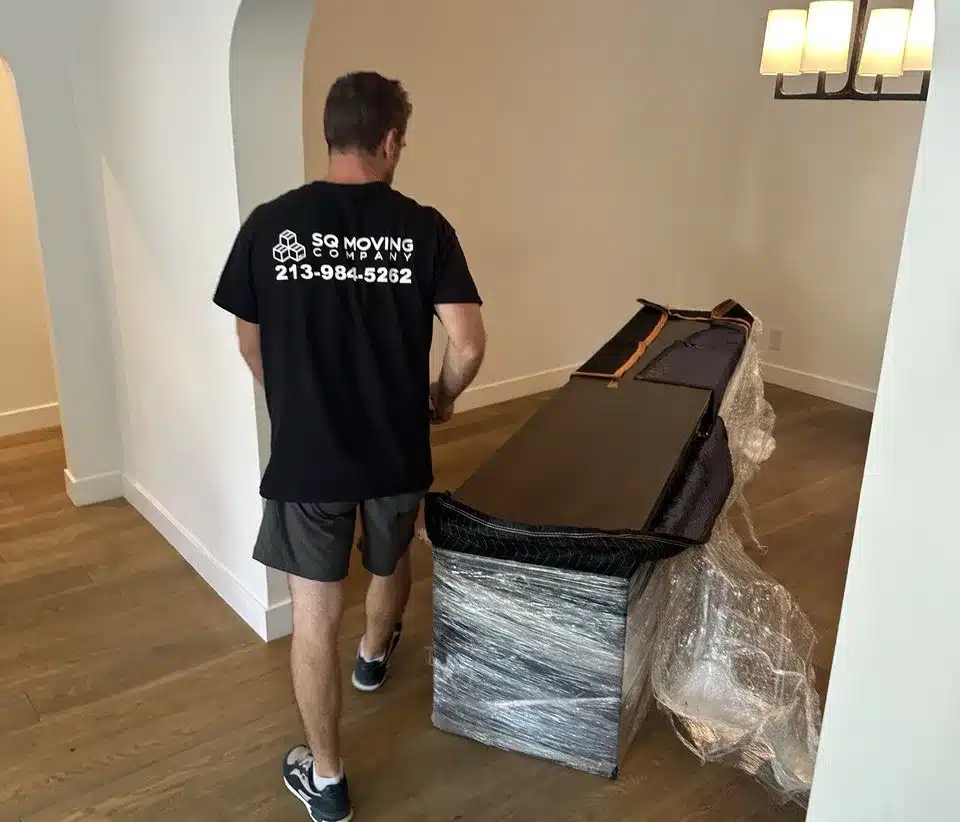 How to Prepare Furniture for Moving in LA: Step-by-Step Guide 2 preparing tv stand for moving, removing the legs during a local move in LA