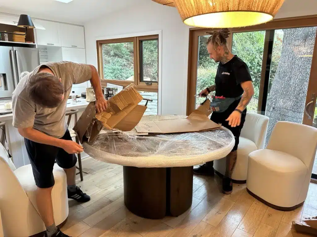 How to Prepare Furniture for Moving in LA: Step-by-Step Guide 5 How to pack a dining table. Packing of delicate dining table with bubble wrap, cardboard and shrink wrap.